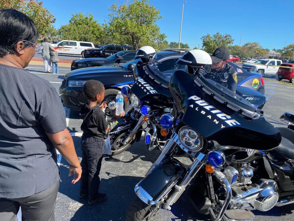 little boy looking at police motorcycles